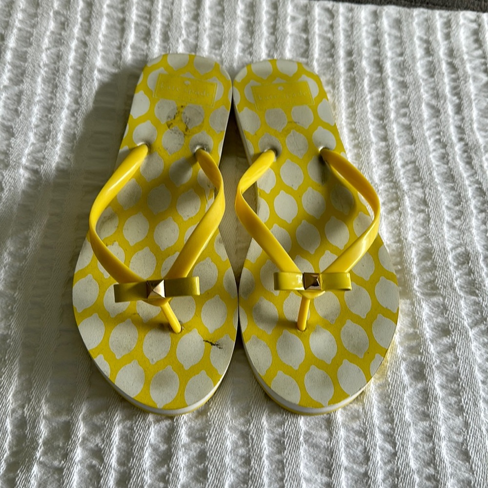 Yellow Kate spade flip flops